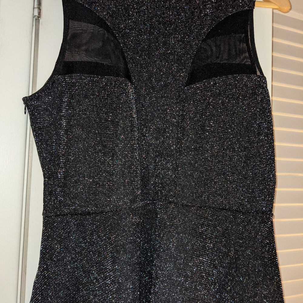 NWOT GUESS black peplum top with mesh inserts size L